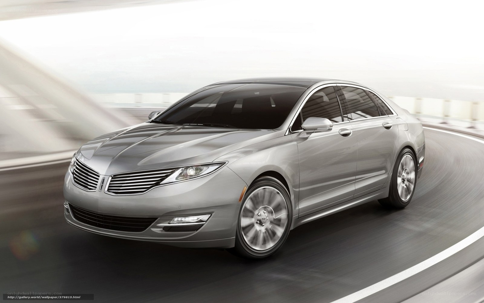 silver lincoln sedan in motion