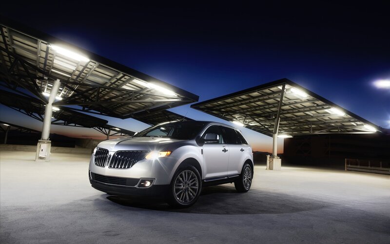 Silver Lincoln SUV at solar charging station