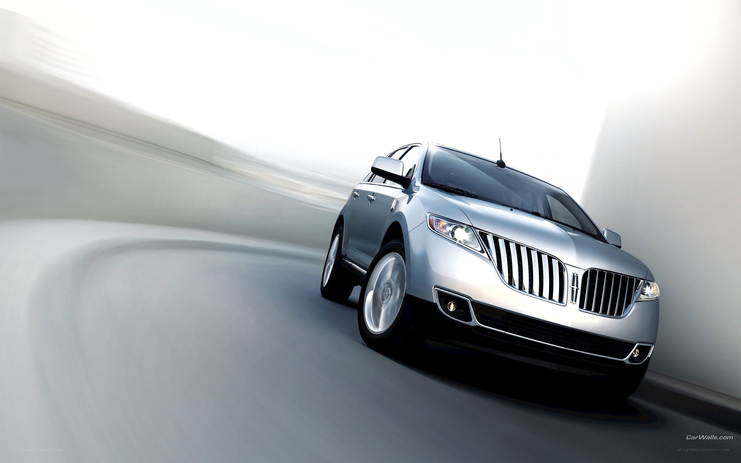 silver lincoln suv in motion