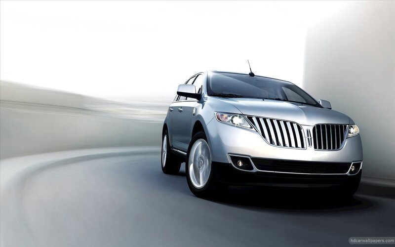 silver lincoln suv in motion