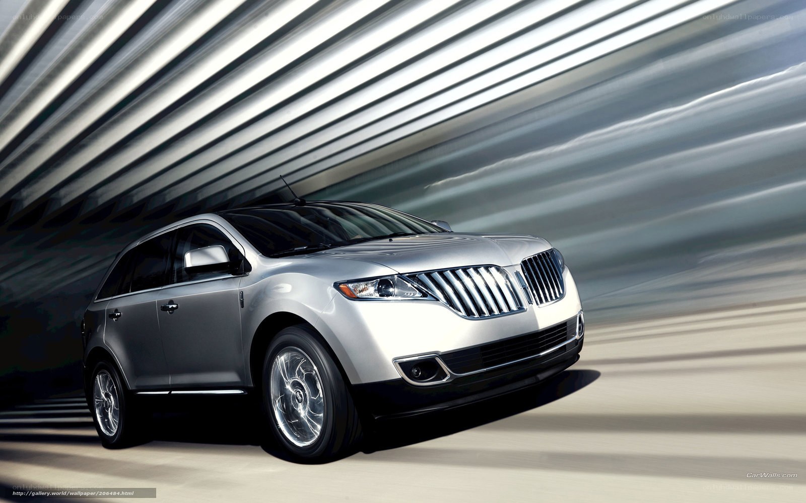 Silver Lincoln SUV in motion