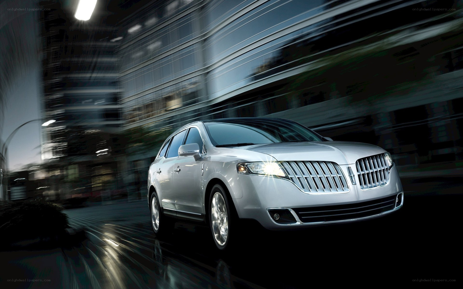 Silver Lincoln SUV in motion