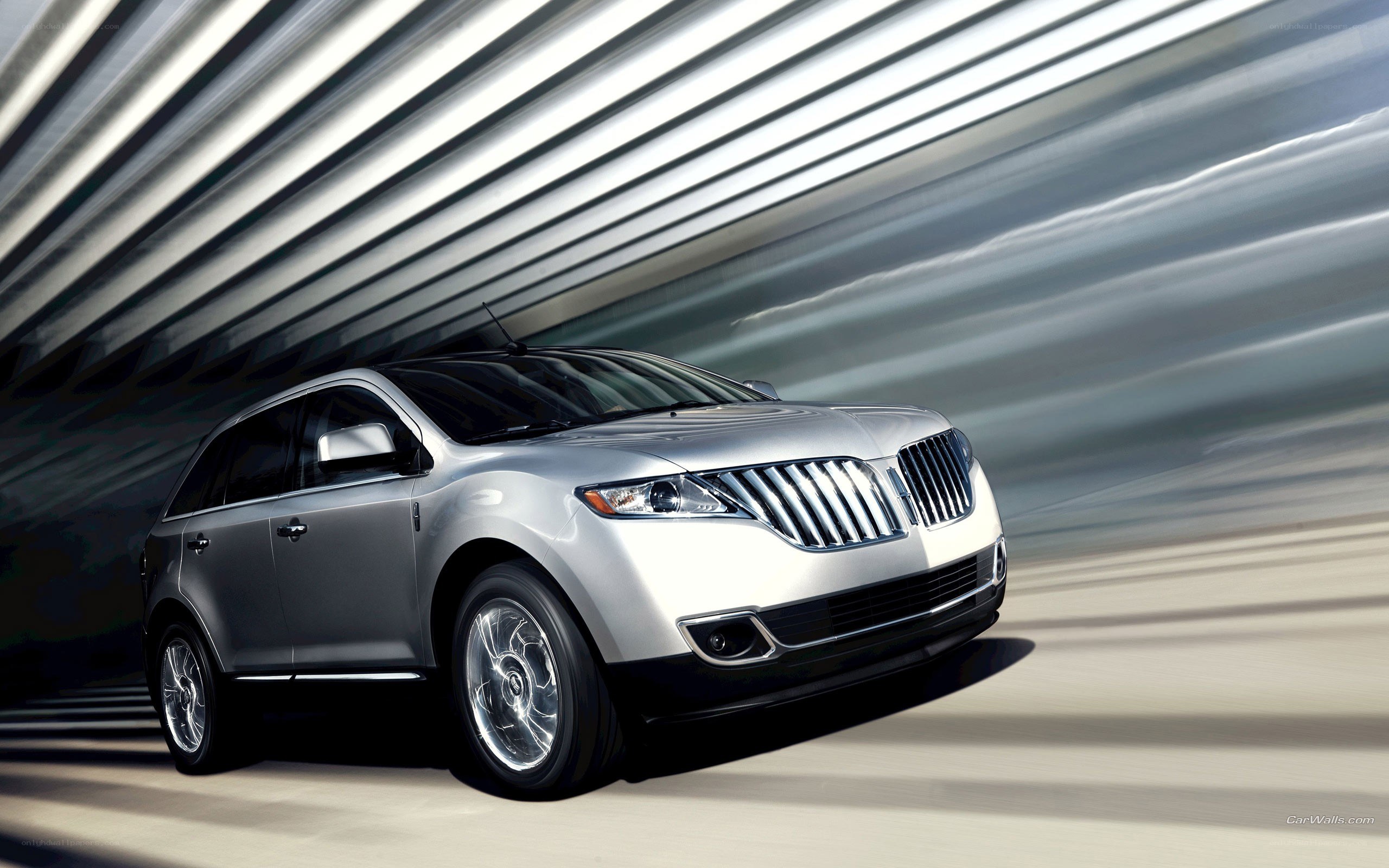 silver lincoln suv in motion