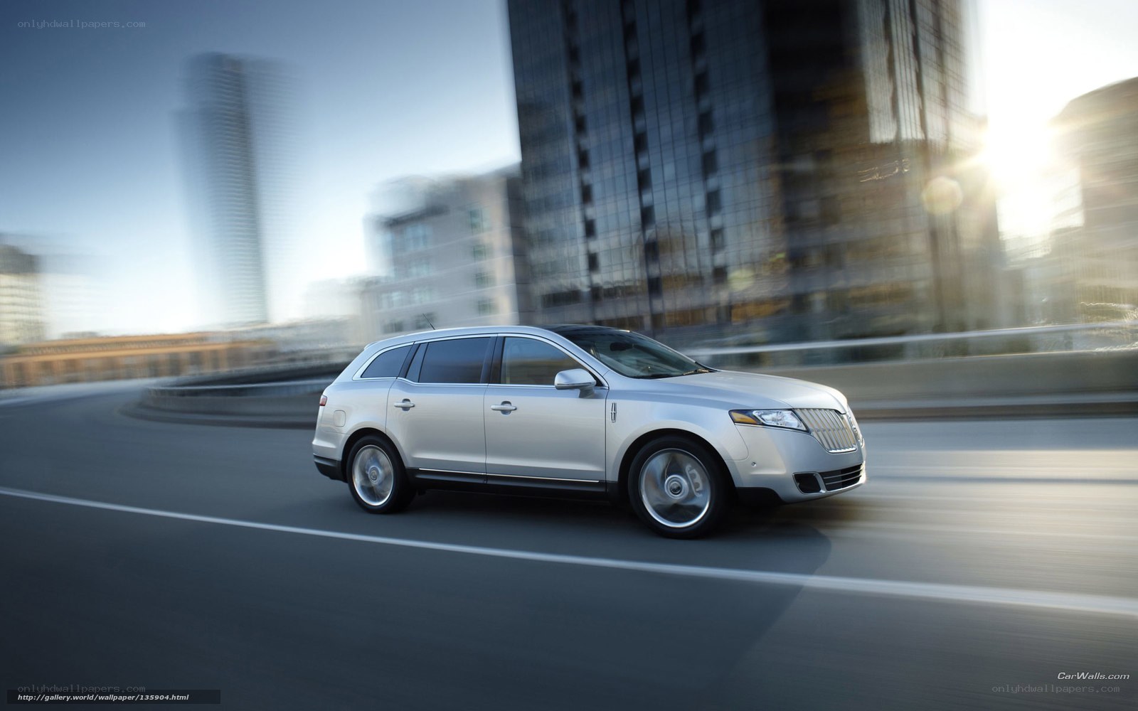 silver lincoln suv in motion