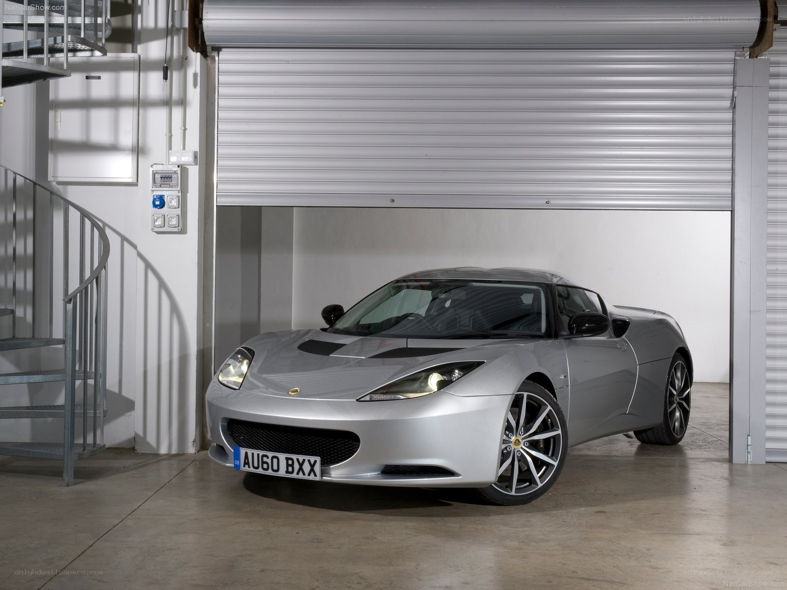 Silver Lotus Evora in garage