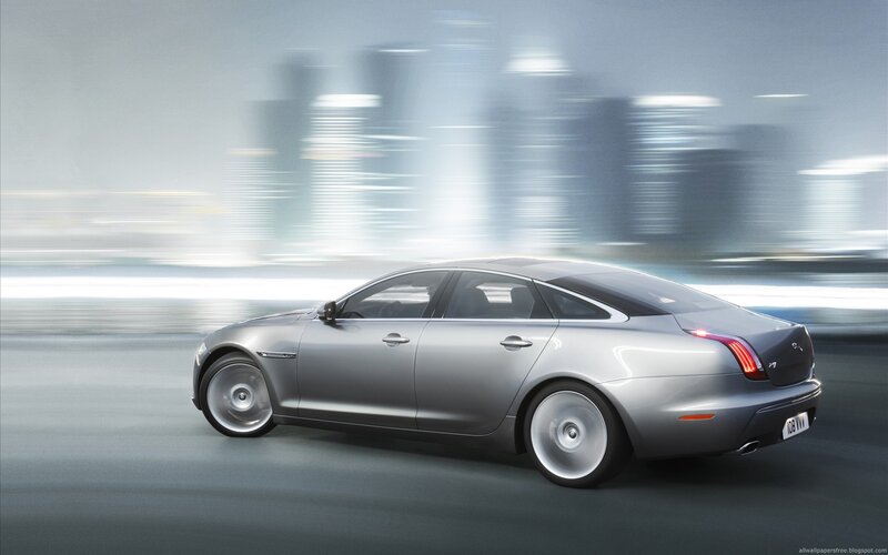 silver luxury car in motion