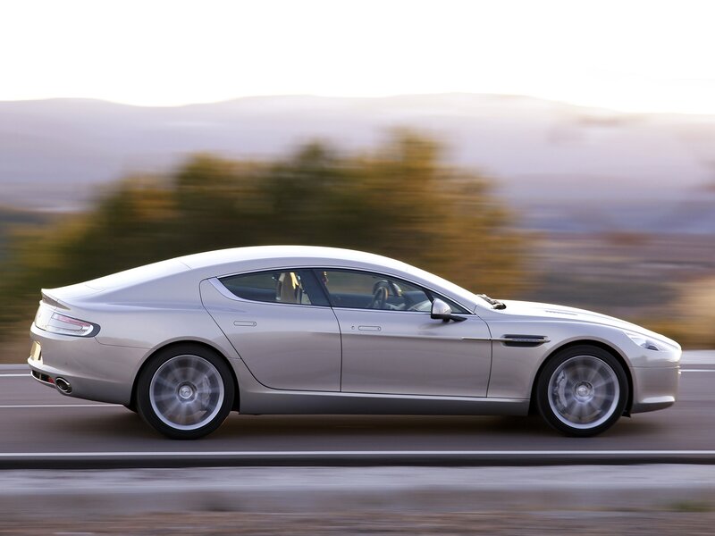 silver luxury car in motion