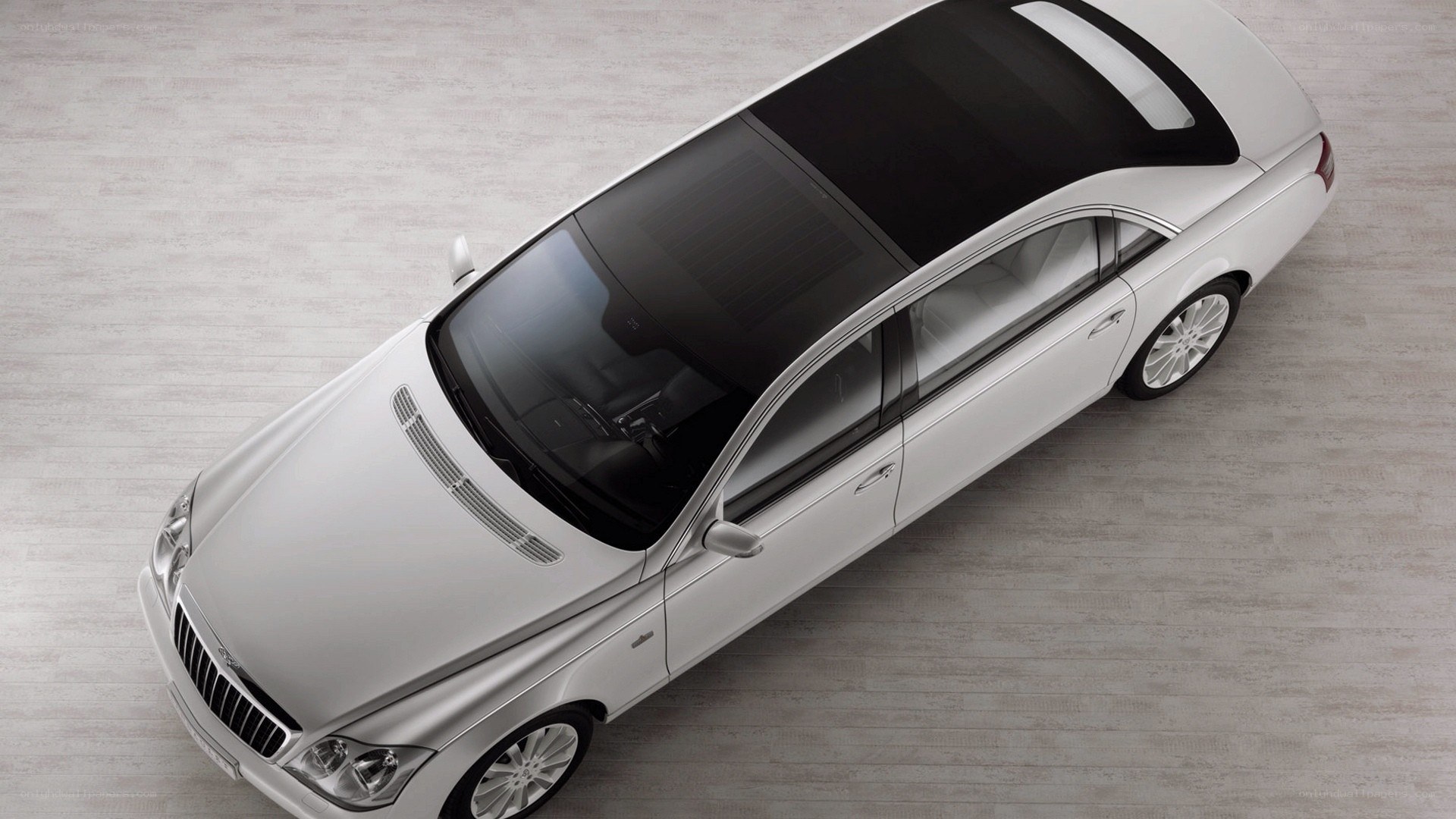 silver luxury sedan from above