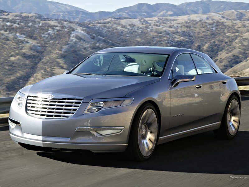silver luxury sedan on mountain road