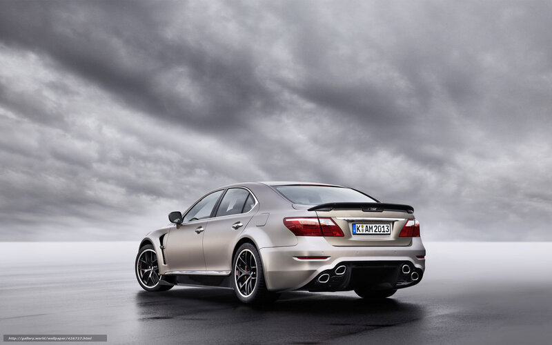 silver luxury sedan on wet road