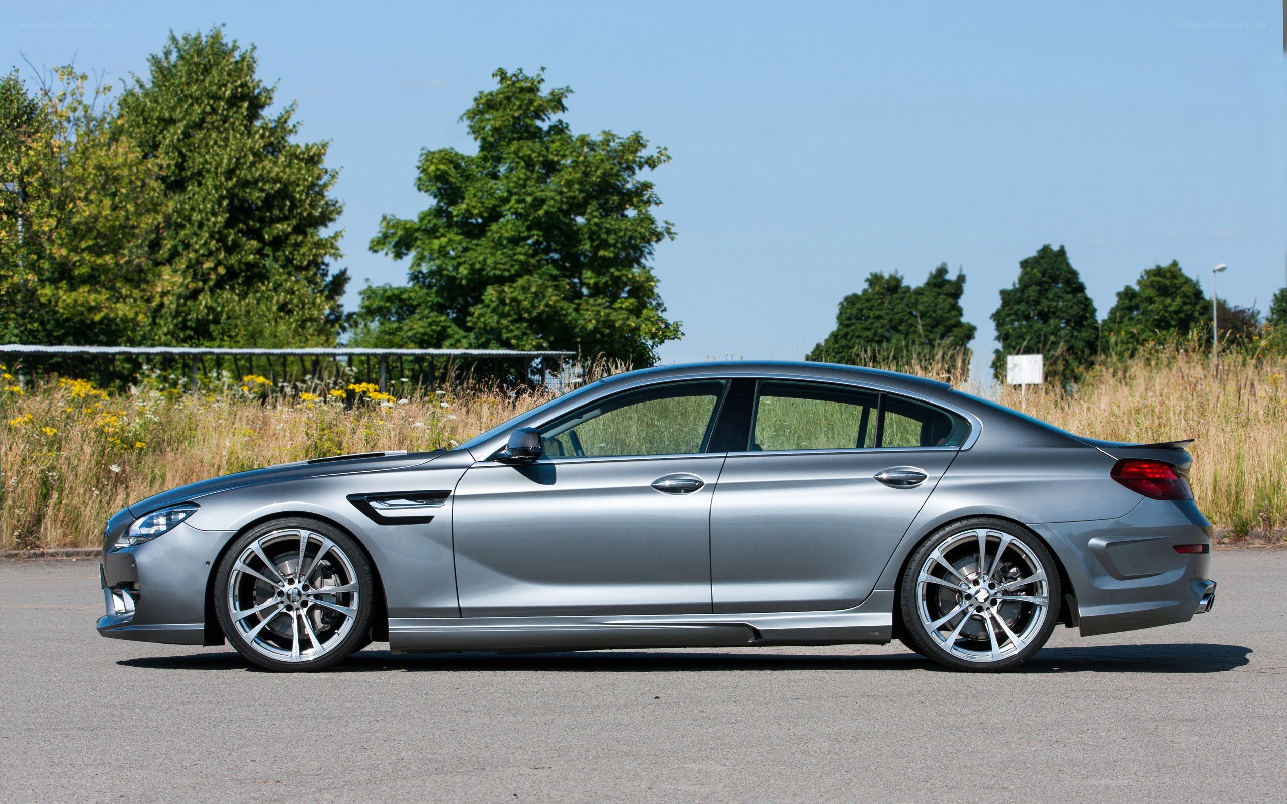silver luxury sedan parked