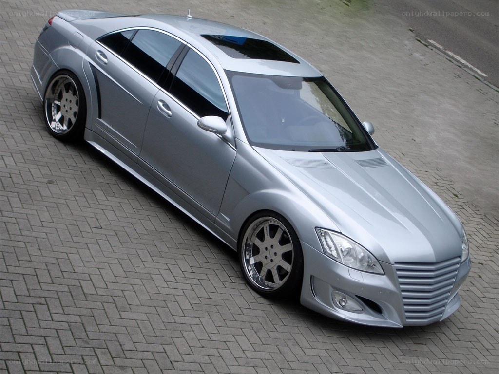 silver luxury sedan with custom wheels