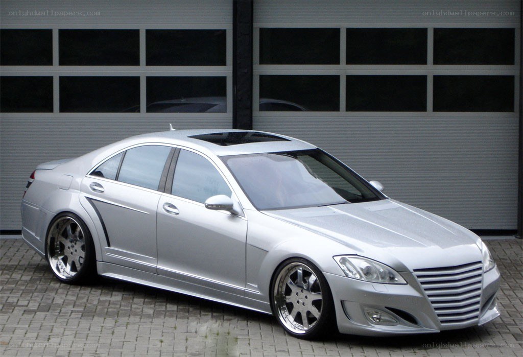 silver luxury sedan with custom wheels
