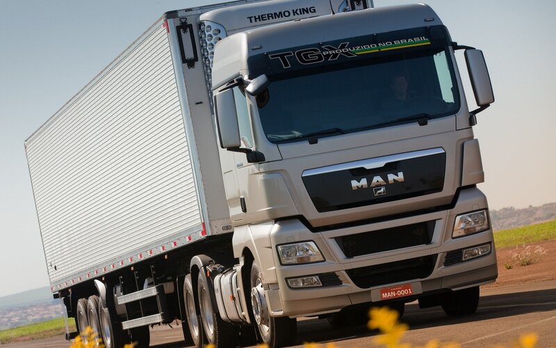 Silver MAN TGX truck on road