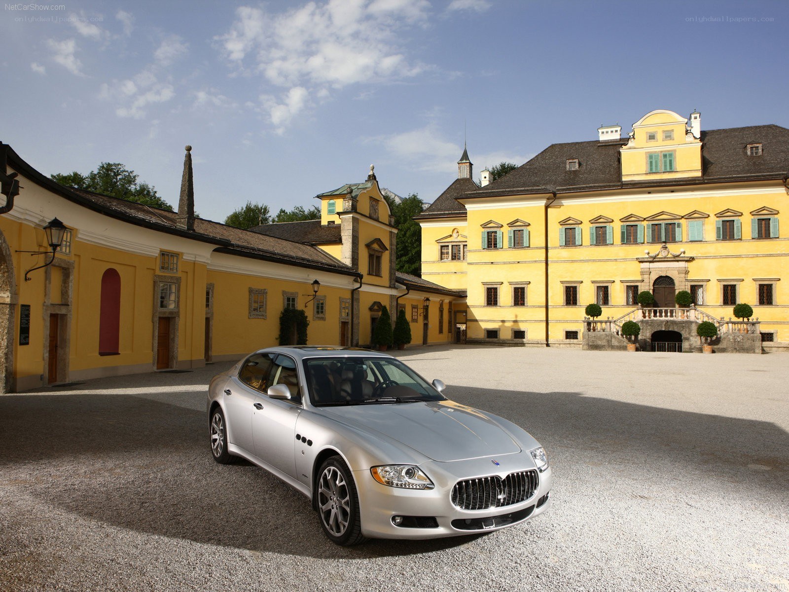 Silver Maserati in courtyard