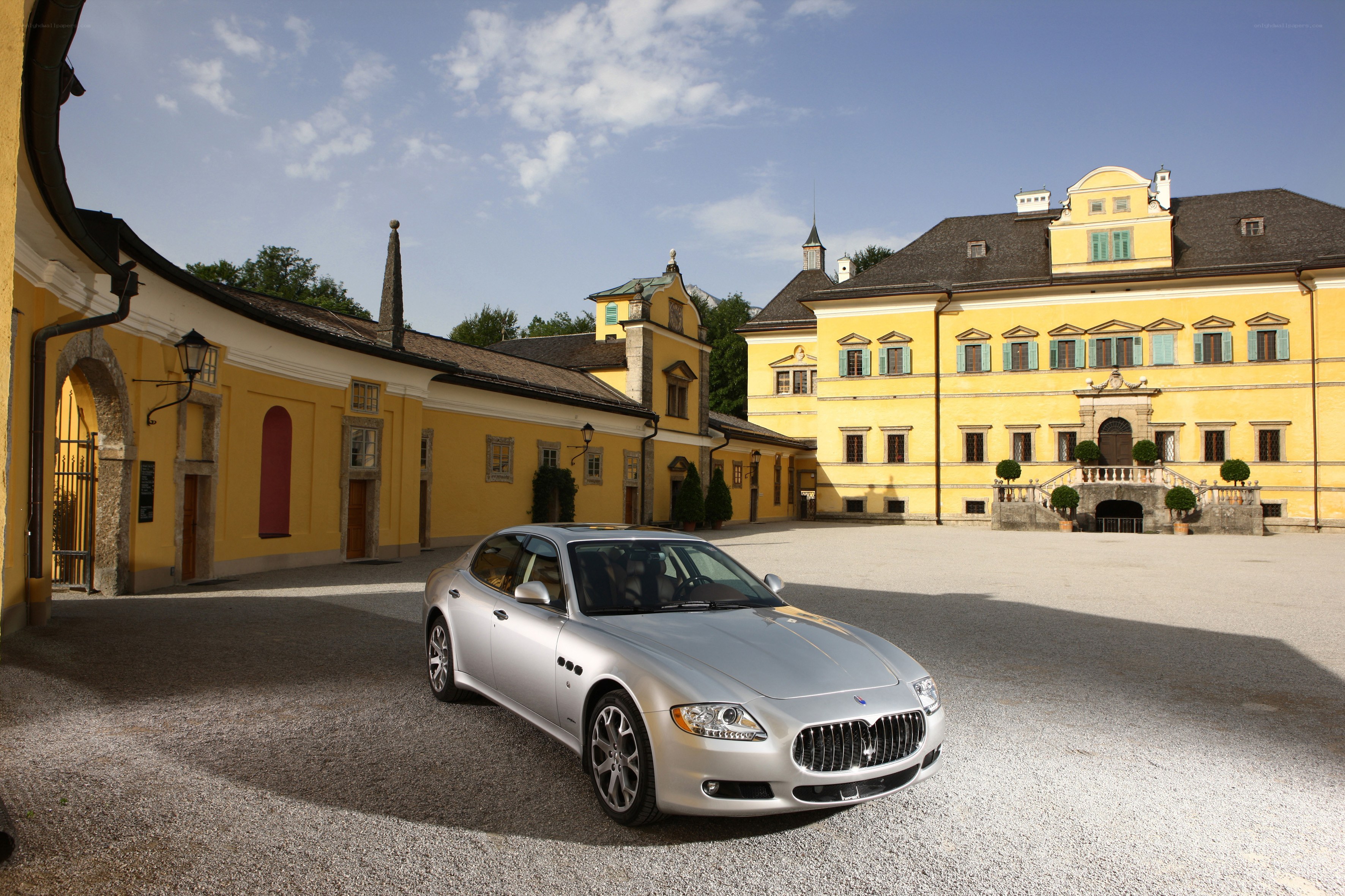 Silver Maserati in courtyard