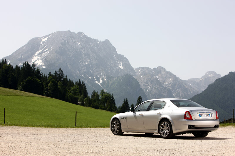 Silver Maserati in mountain landscape