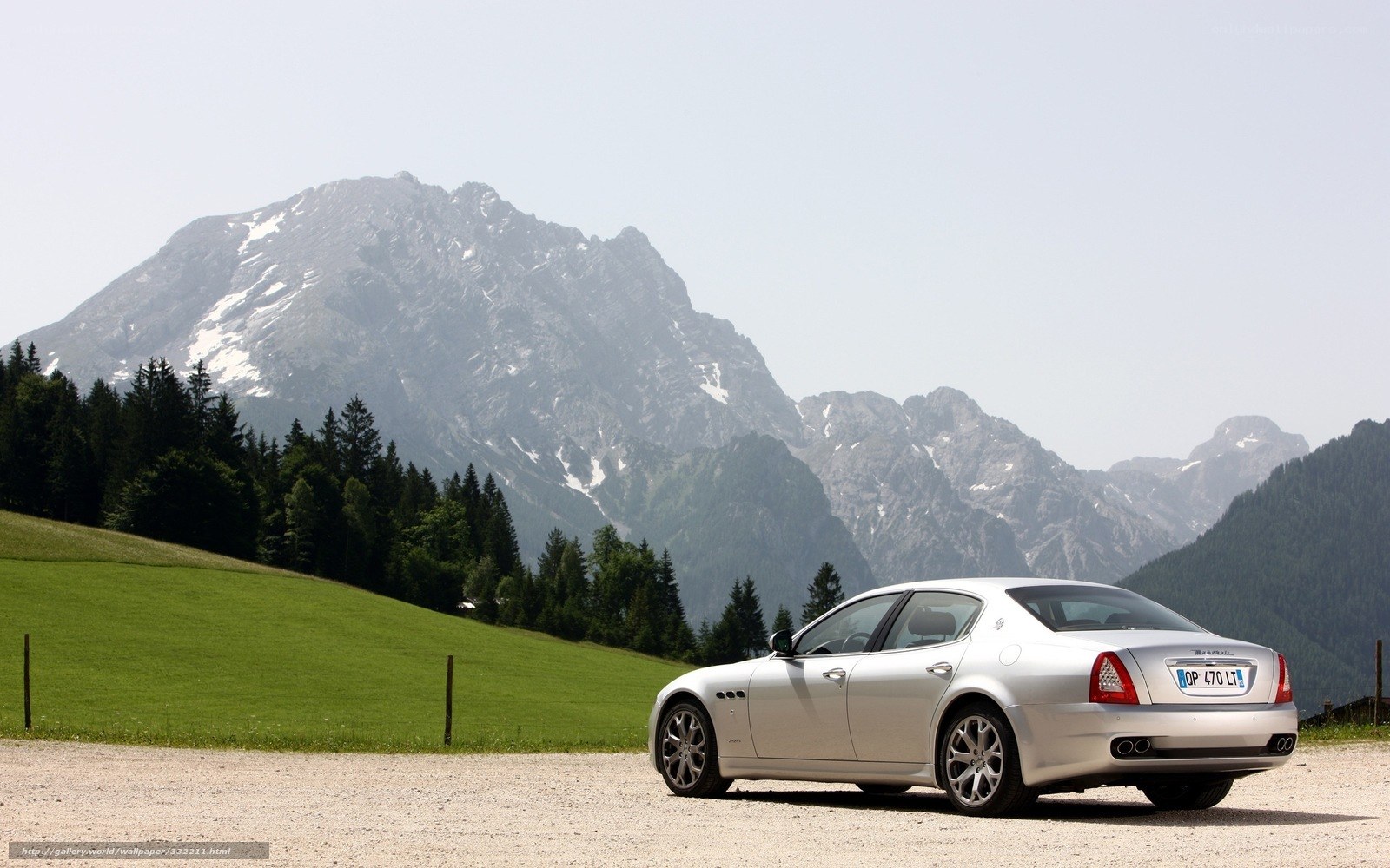 Silver Maserati in mountain landscape