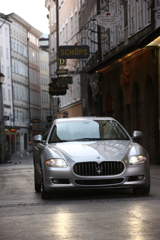 Silver Maserati on a city street