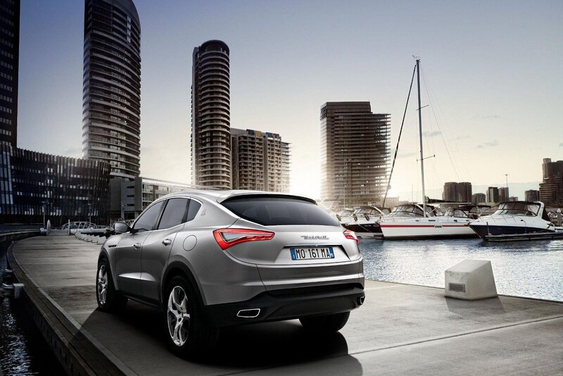 Silver Maserati on a dock