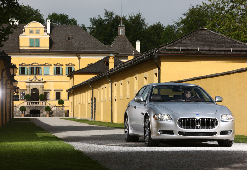 Silver Maserati on a gravel driveway