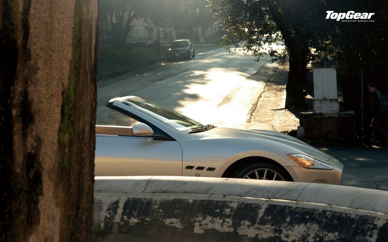 Silver Maserati on a quiet street