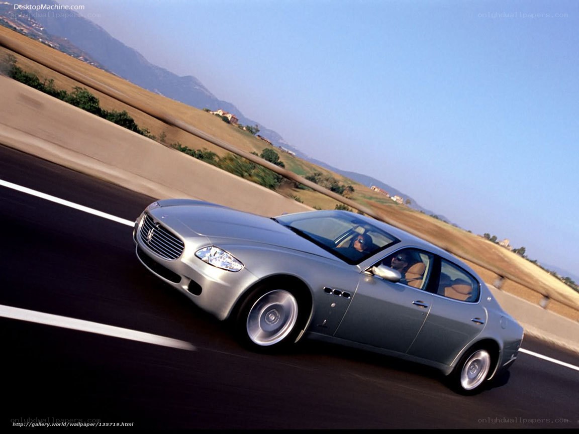 silver maserati on a winding road
