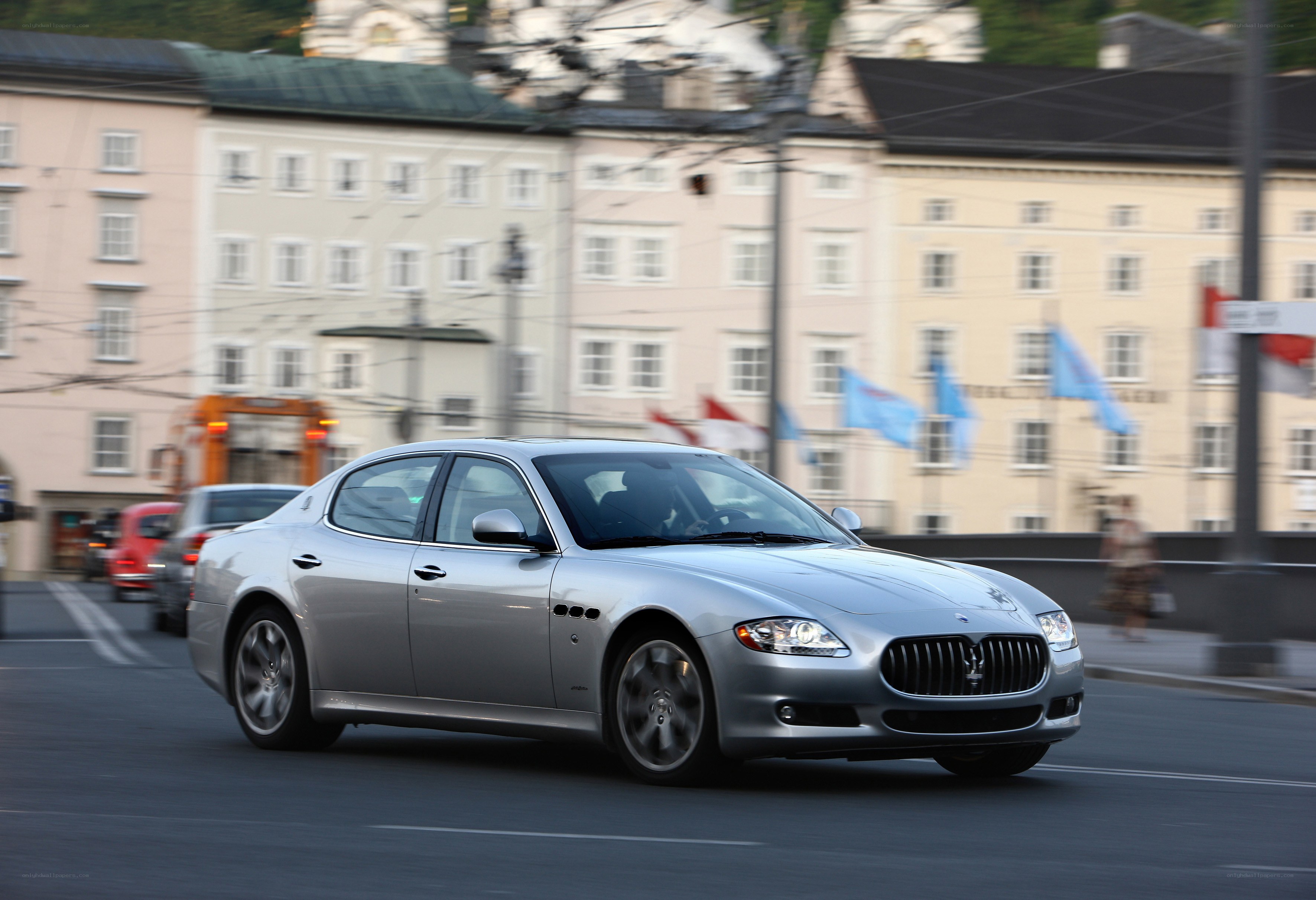 Silver Maserati on city street