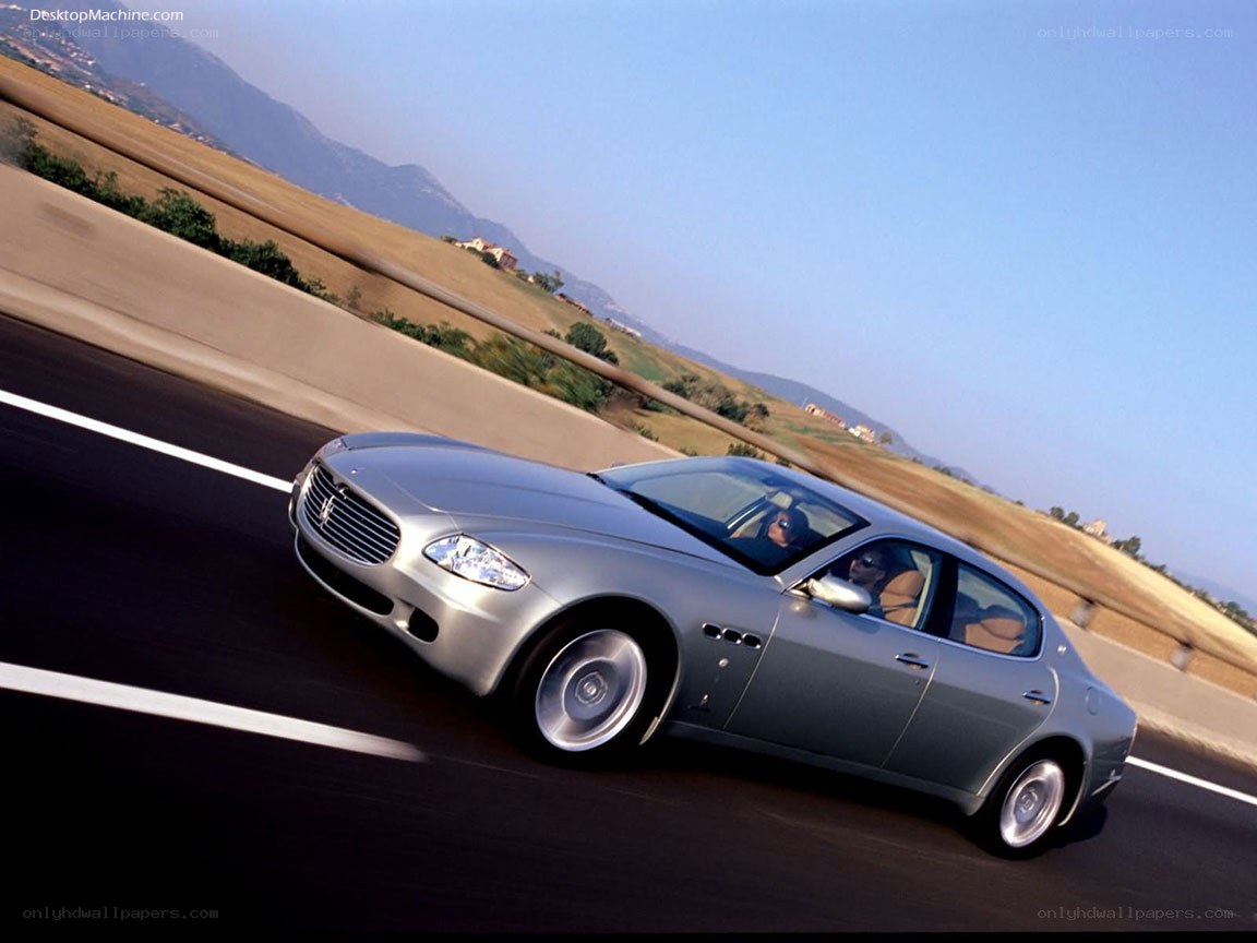 silver maserati on highway