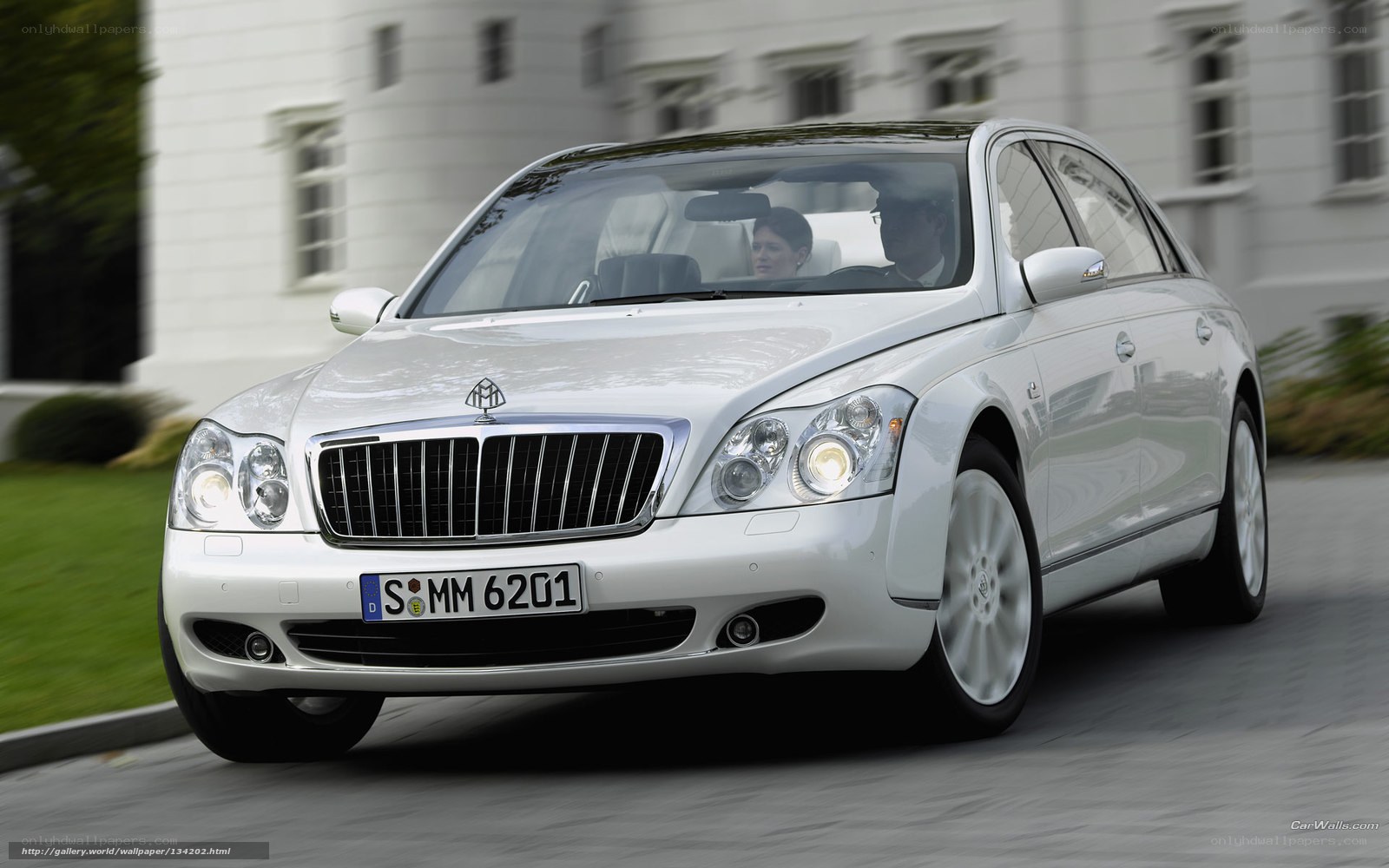 silver maybach sedan in motion