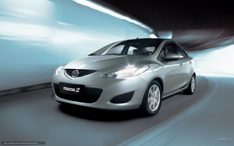 Silver Mazda 2 in motion