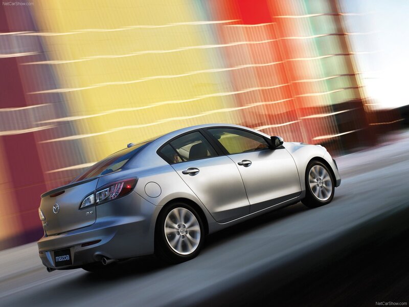 silver mazda 3 in motion