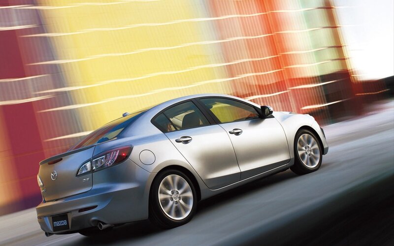 silver mazda 3 in motion