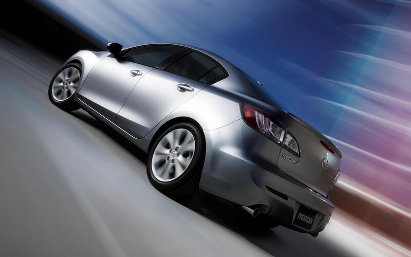 silver mazda 3 in motion