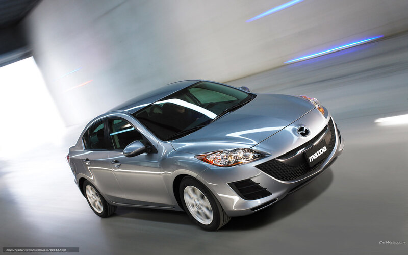 Silver Mazda 3 in motion