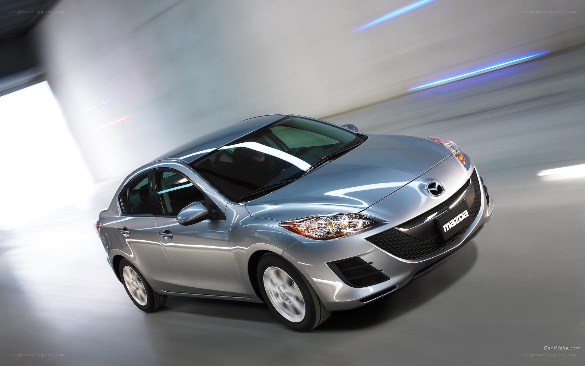 silver mazda 3 sedan