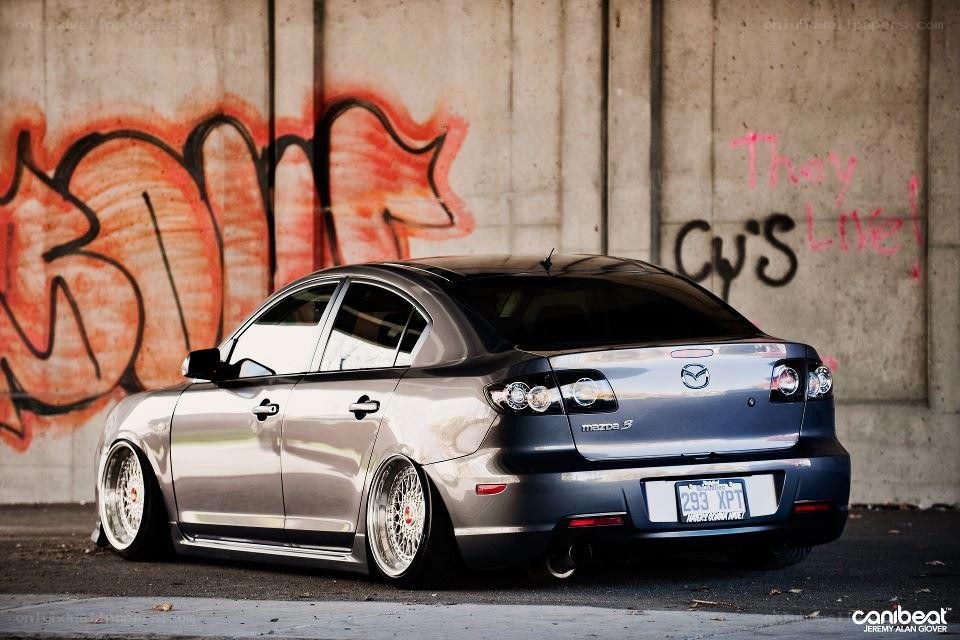 silver mazda 3 with custom wheels