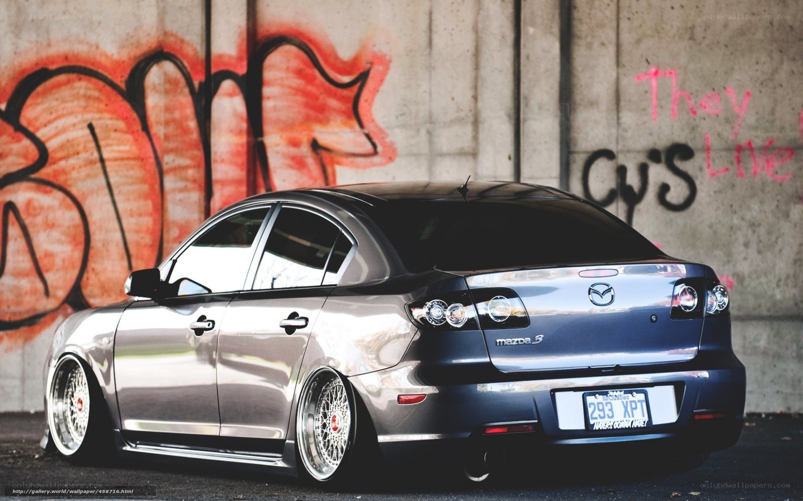 silver mazda 3 with custom wheels