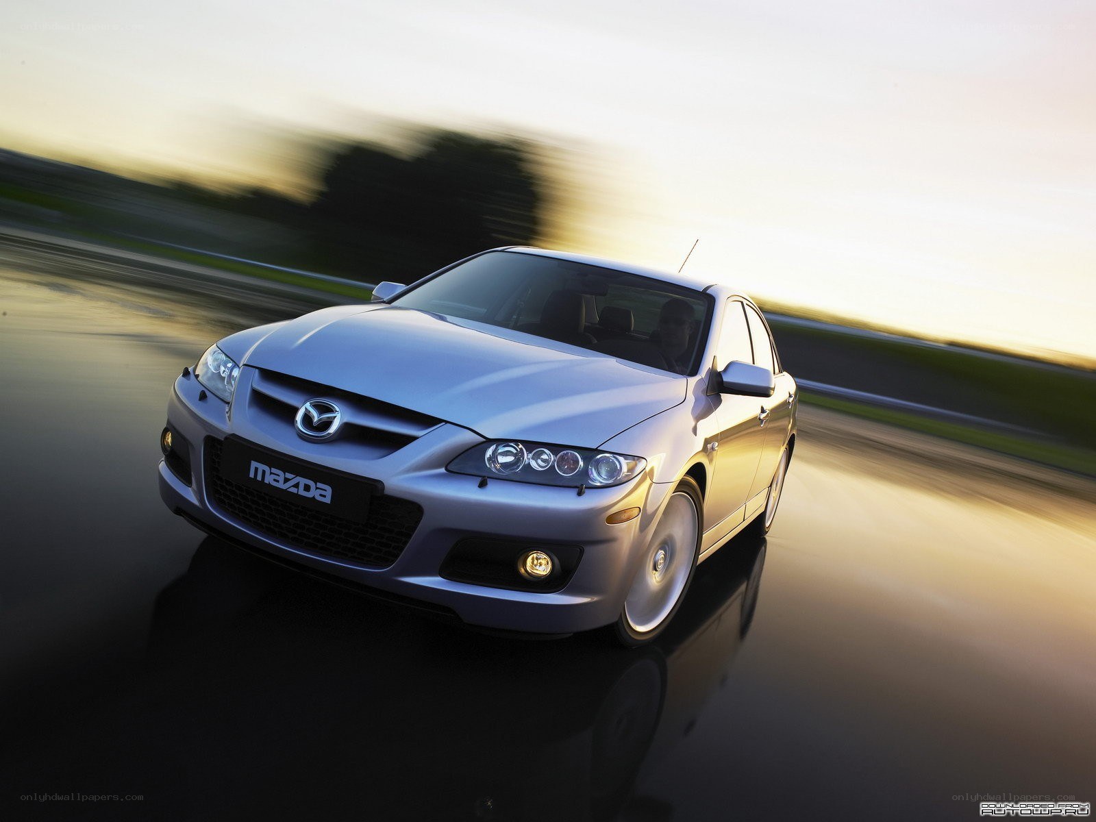 Silver Mazda 6 in motion