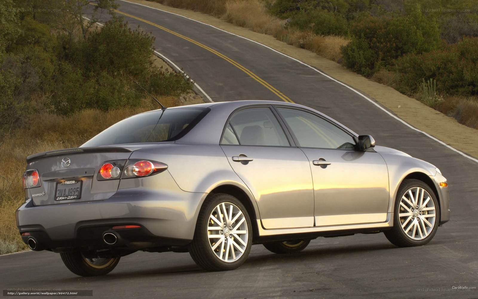 silver mazda 6 on winding road