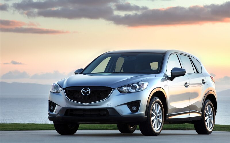 Silver Mazda CX-5 by the sea