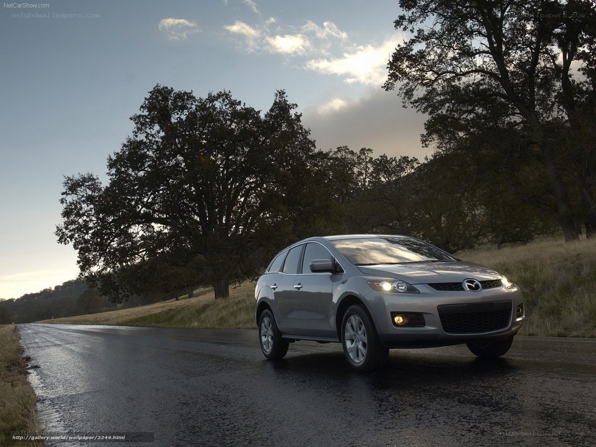 Silver Mazda CX-7 on a country road