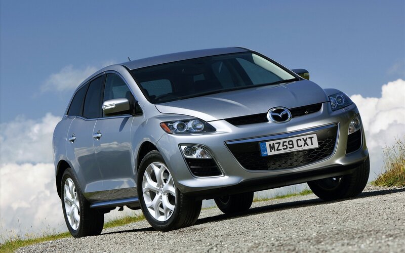 Silver Mazda CX-7 on gravel road