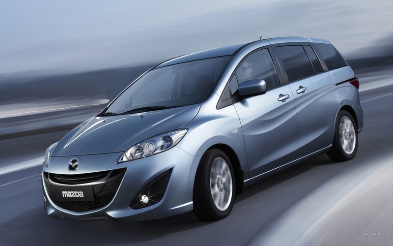silver mazda mpv in motion