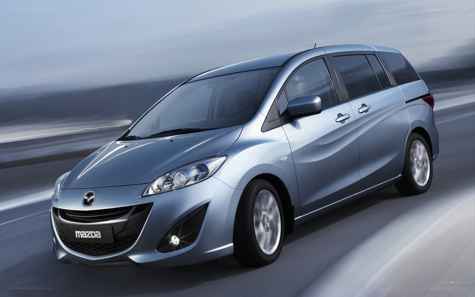 silver mazda mpv in motion