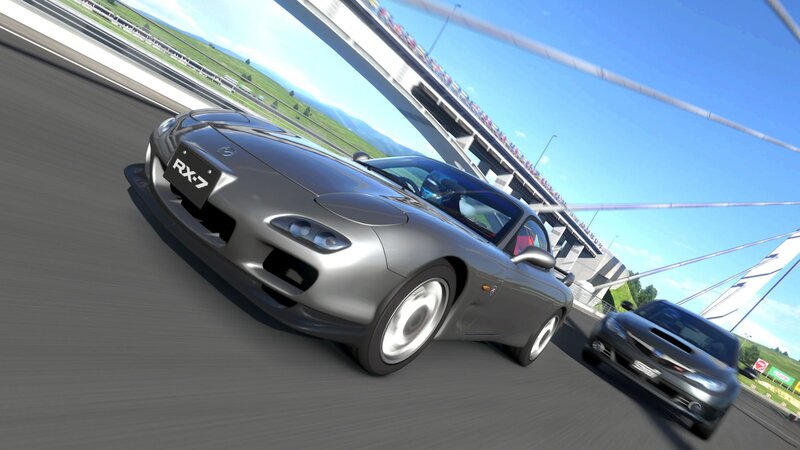Silver Mazda RX-7 racing