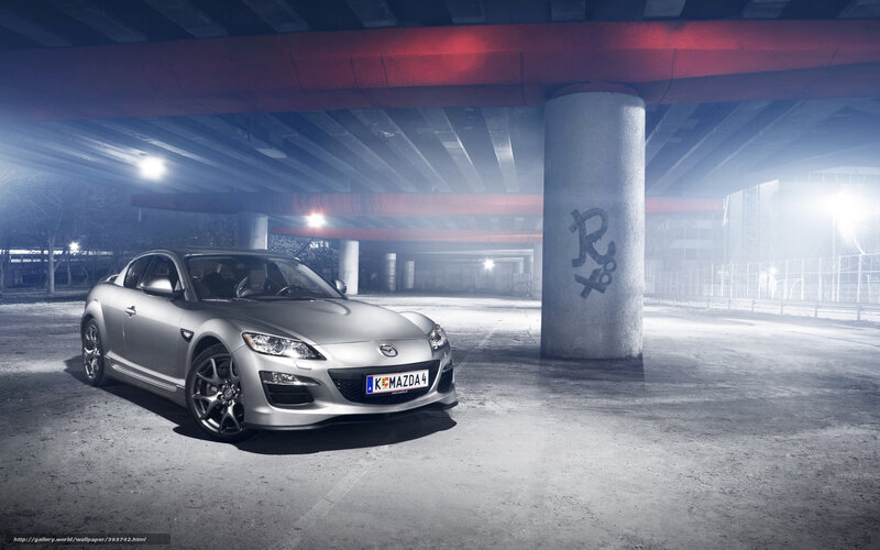 Silver Mazda RX-8 under bridge