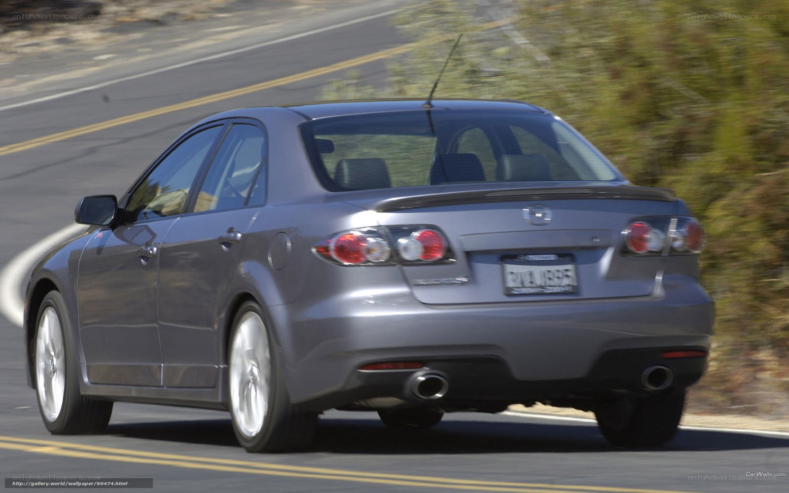 silver mazda sedan on road