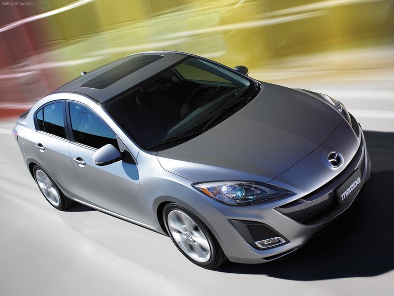 Silver Mazda3 in motion