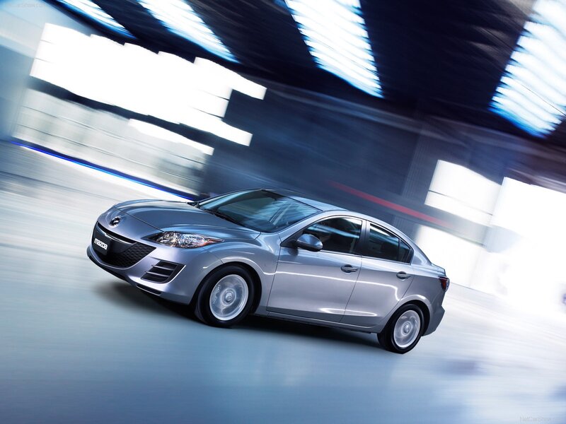 Silver Mazda3 in motion